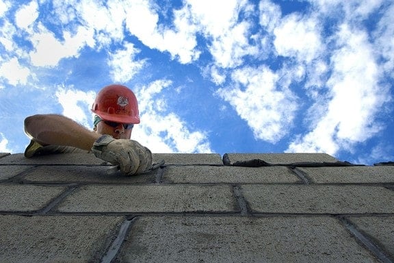 Construction worker laying brick mechanic's lien